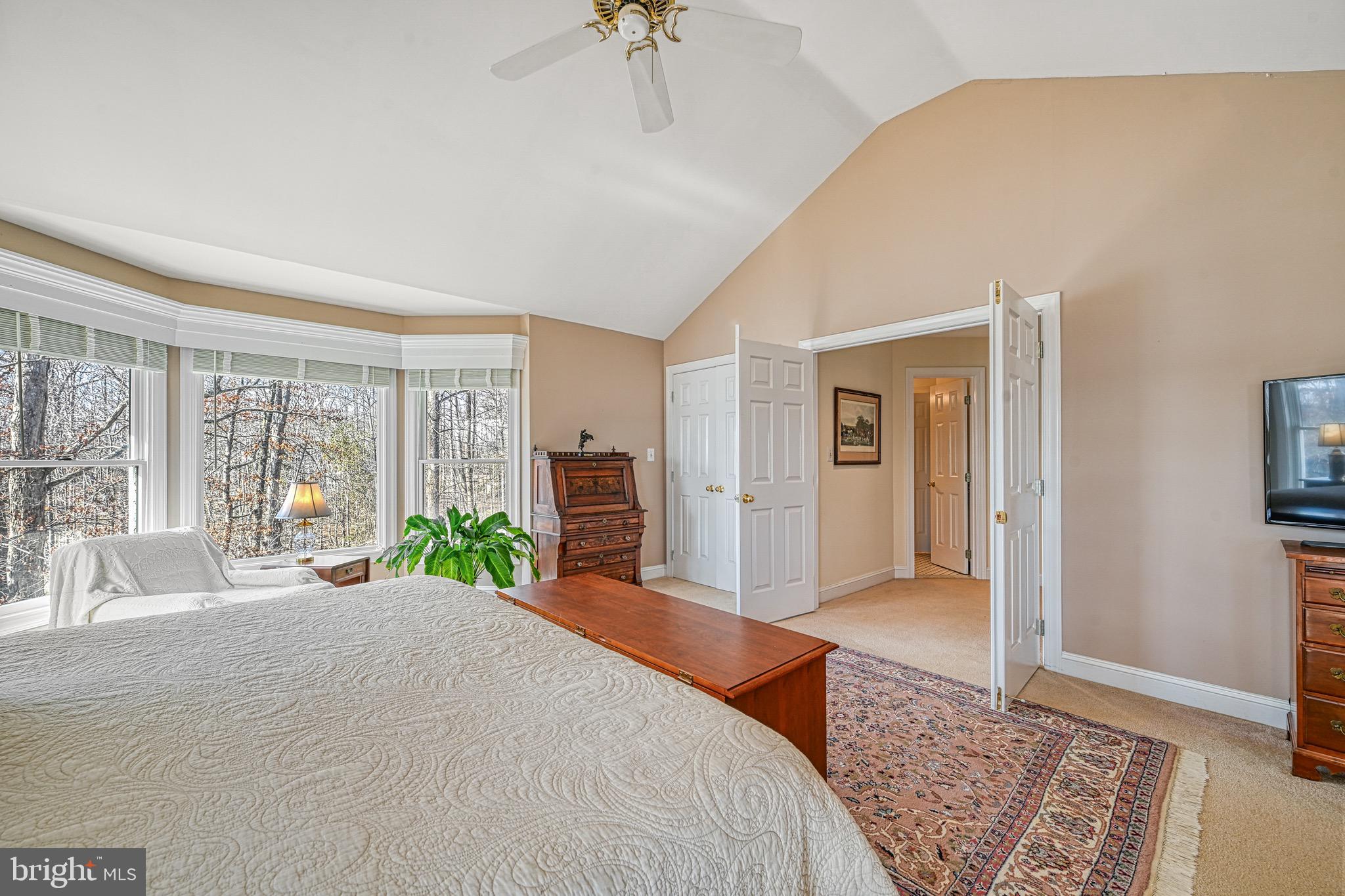 175 Covenant Way Bumpass, VA 23024 - Photo 123 of 140 a bedroom with a bed and glass windows