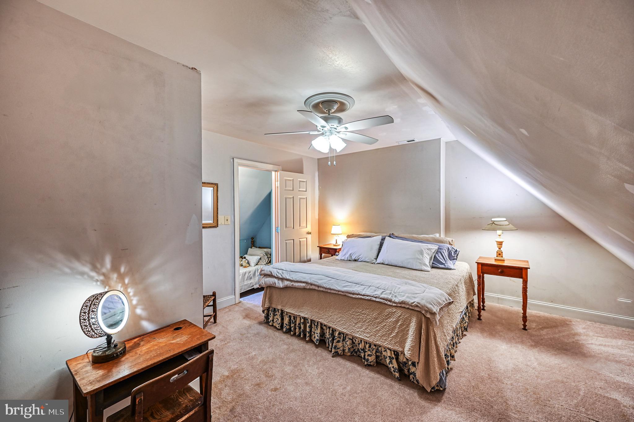 175 Covenant Way Bumpass, VA 23024 - Photo 135 of 140 a spacious bedroom with a bed and a chandelier