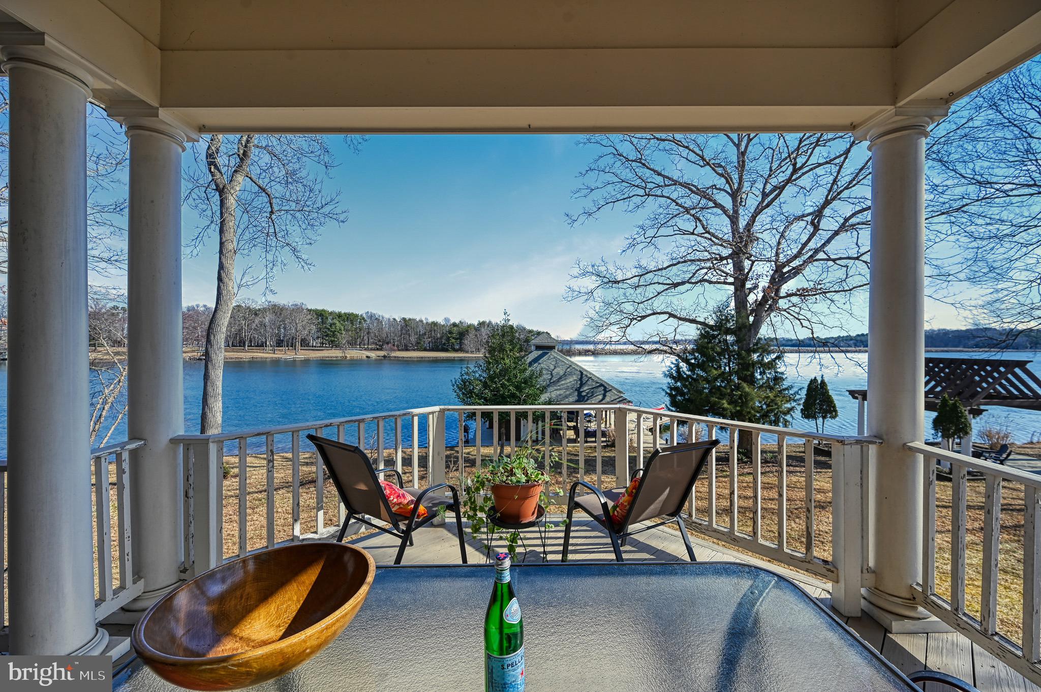 175 Covenant Way Bumpass, VA 23024 - Photo 59 of 140 a view of a balcony with chairs and wooden fence