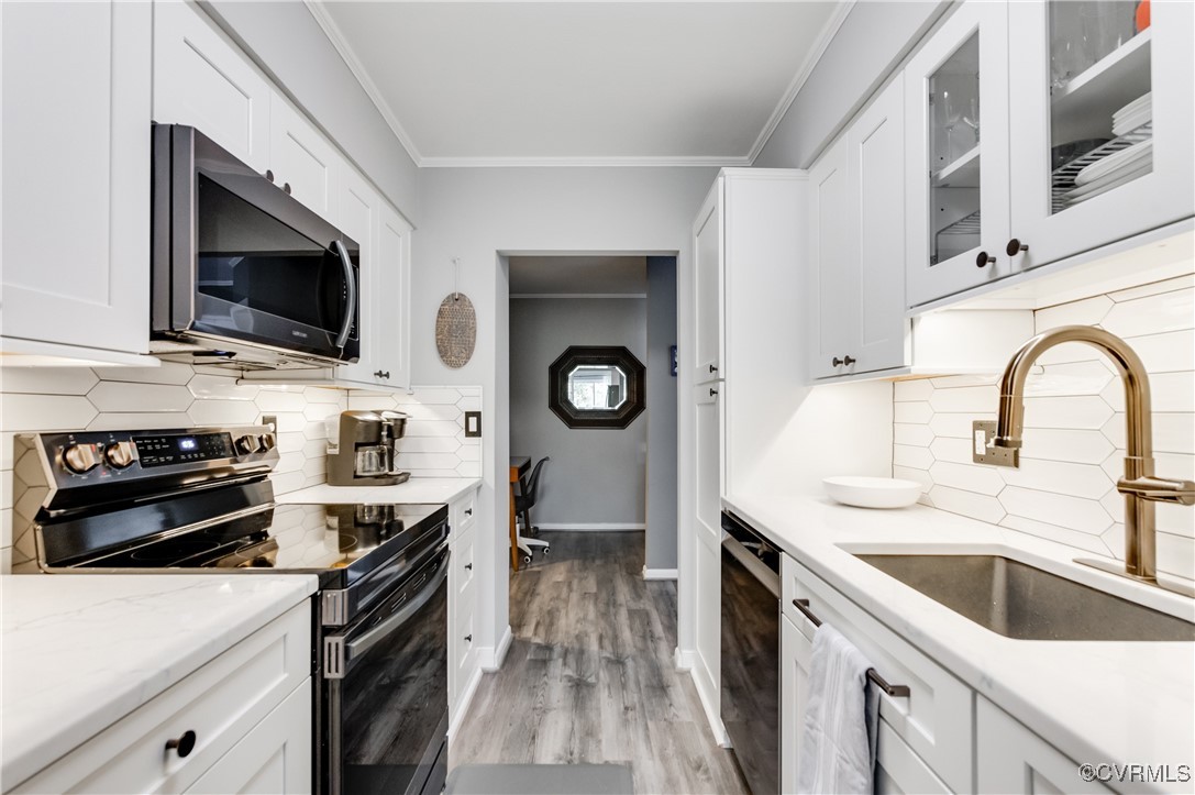 1507 Regency Woods Road, Unit 103 Henrico, VA 23238 - Photo 1 of 32 Kitchen featuring tasteful backsplash, appliances