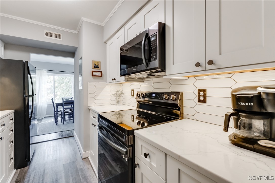 1507 Regency Woods Road, Unit 103 Henrico, VA 23238 - Photo 3 of 32 Kitchen featuring stainless steel appliances, back