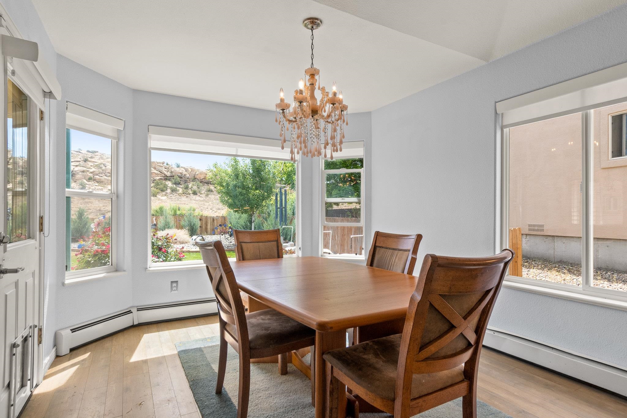 398 Butte Court Grand Junction, CO 81507 - Photo 6 of 33 a view of a dining room with furniture window and outside view