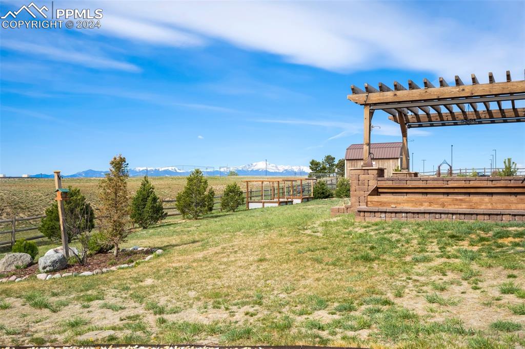 11501 Palmers Green Drive Peyton, CO 80831 - Photo 12 of 49 a backyard of a house with table and chairs
