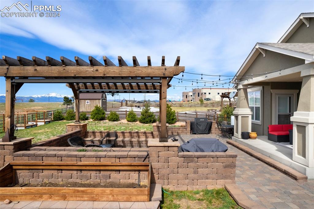 11501 Palmers Green Drive Peyton, CO 80831 - Photo 14 of 49 a living room with furniture and a fireplace