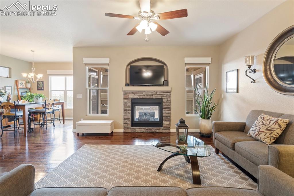 11501 Palmers Green Drive Peyton, CO 80831 - Photo 16 of 49 a living room with furniture and a fireplace
