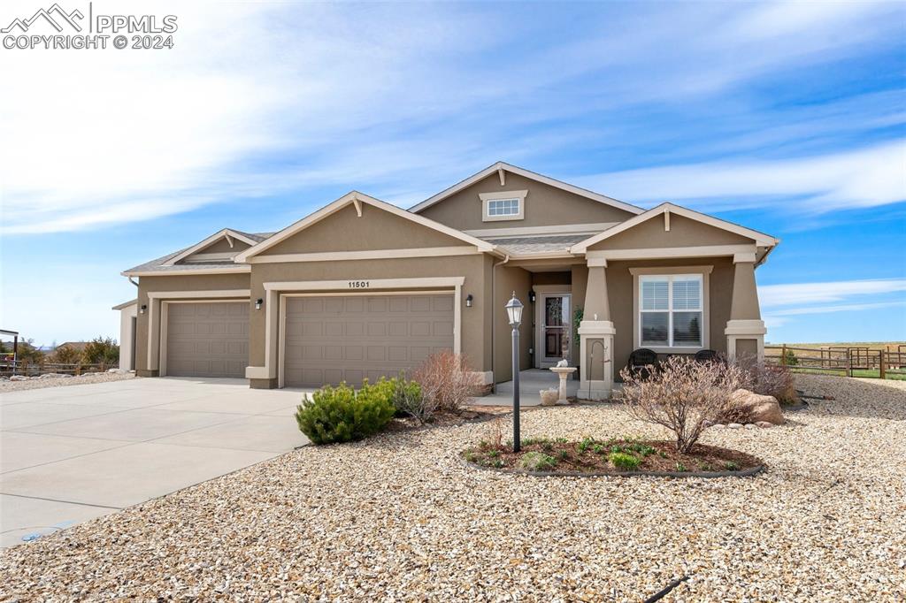 11501 Palmers Green Drive Peyton, CO 80831 - Photo 2 of 49 a front view of a house with a porch