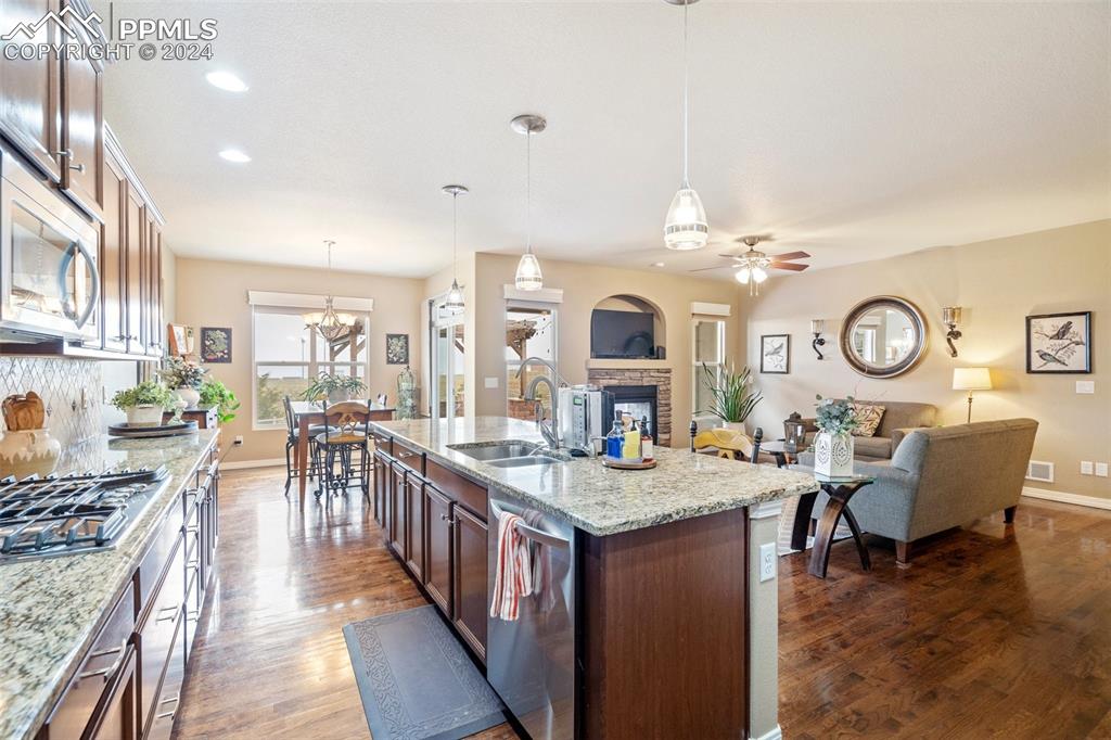 11501 Palmers Green Drive Peyton, CO 80831 - Photo 24 of 49 a living room with granite countertop kitchen island furniture and a kitchen view