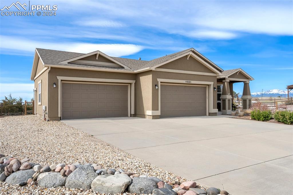 11501 Palmers Green Drive Peyton, CO 80831 - Photo 3 of 49 a front view of a house with a yard