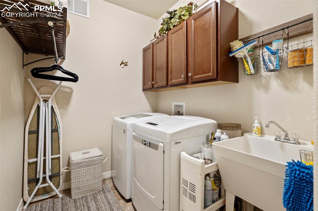 11501 Palmers Green Drive Peyton, CO 80831 - Photo 36 of 49 a utility room with dryer and washer