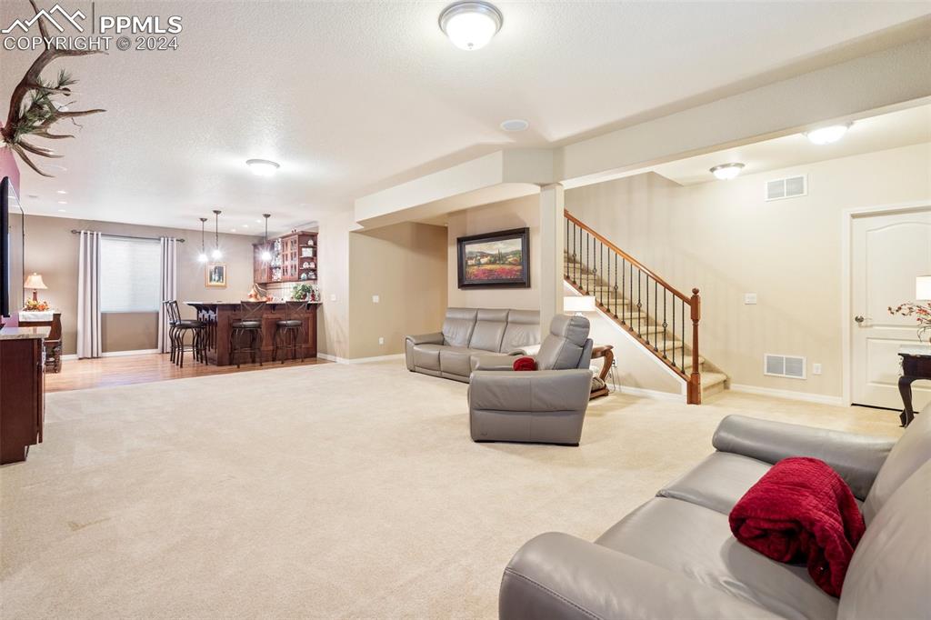 11501 Palmers Green Drive Peyton, CO 80831 - Photo 38 of 49 a living room with furniture and a large window
