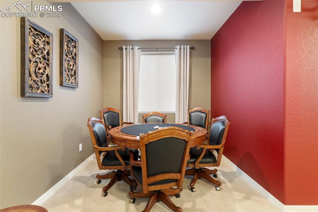 11501 Palmers Green Drive Peyton, CO 80831 - Photo 40 of 49 a view of a workspace with furniture and window