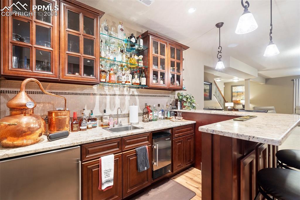 11501 Palmers Green Drive Peyton, CO 80831 - Photo 42 of 49 a kitchen with a sink and cabinets