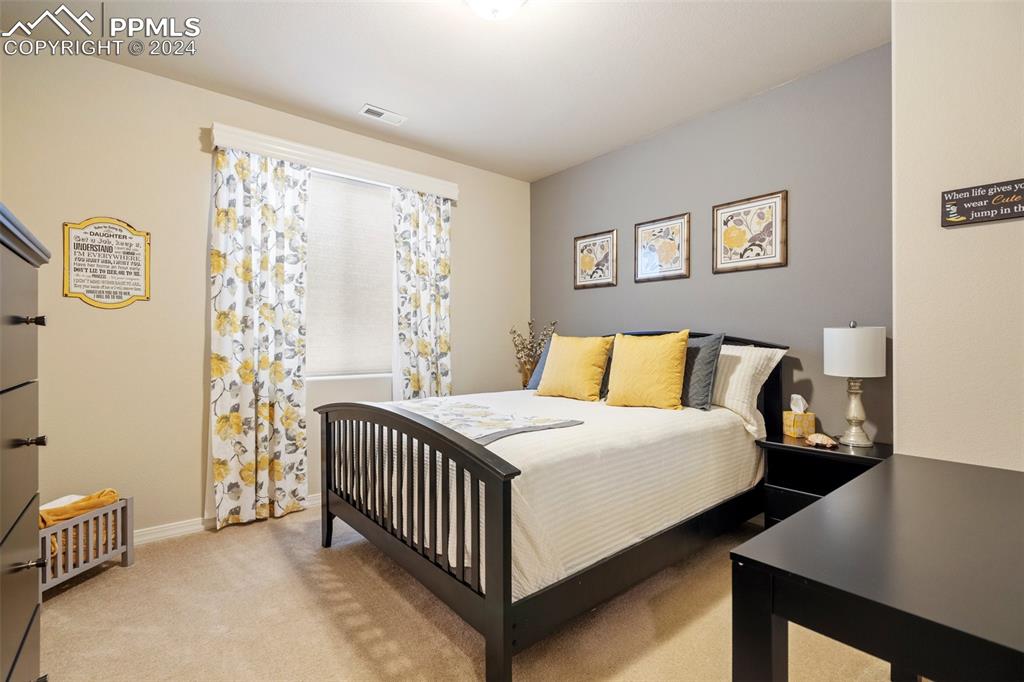 11501 Palmers Green Drive Peyton, CO 80831 - Photo 44 of 49 a bedroom with a bed and a window