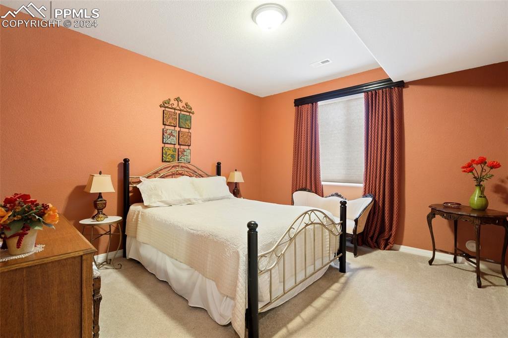 11501 Palmers Green Drive Peyton, CO 80831 - Photo 45 of 49 a bedroom with a bed and a window