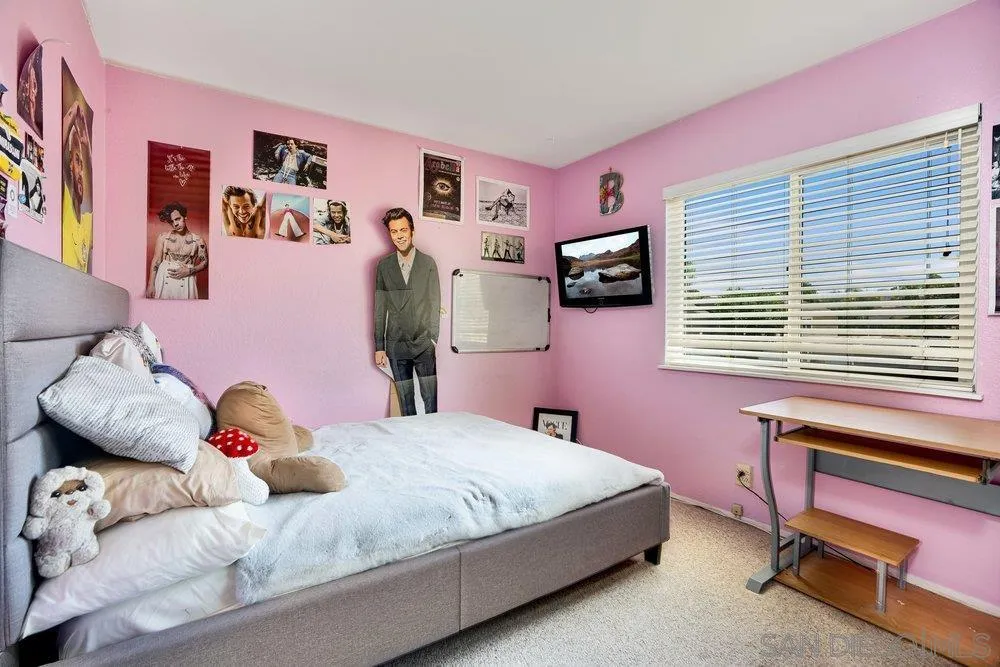 13358 Birch Tree Lane Poway, CA 92064 - Photo 14 of 16 a bedroom with a bed and a dresser