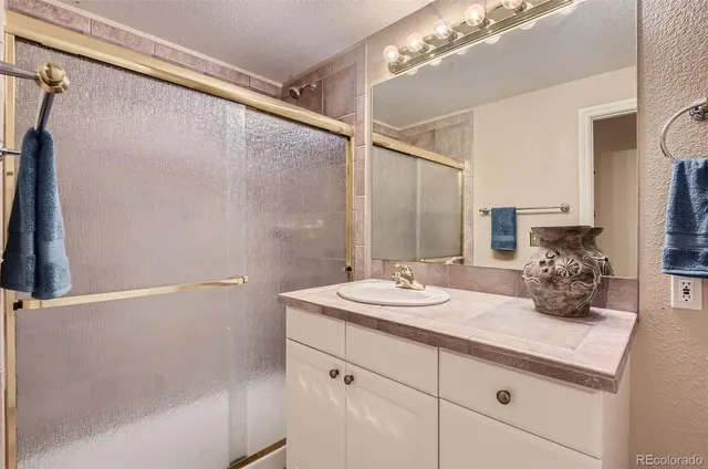 a bathroom with a double vanity sink and mirror