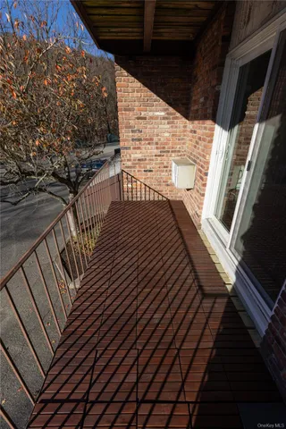 a view of balcony with wooden floor