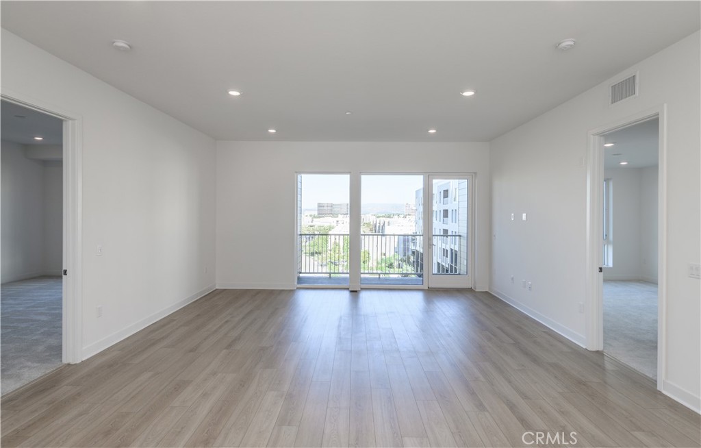 3608 Rivington Irvine, CA 92612 - Photo 14 of 53 an empty room with wooden floor and windows