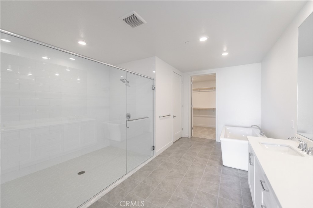 3608 Rivington Irvine, CA 92612 - Photo 26 of 53 a bathroom with a bathtub and a shower