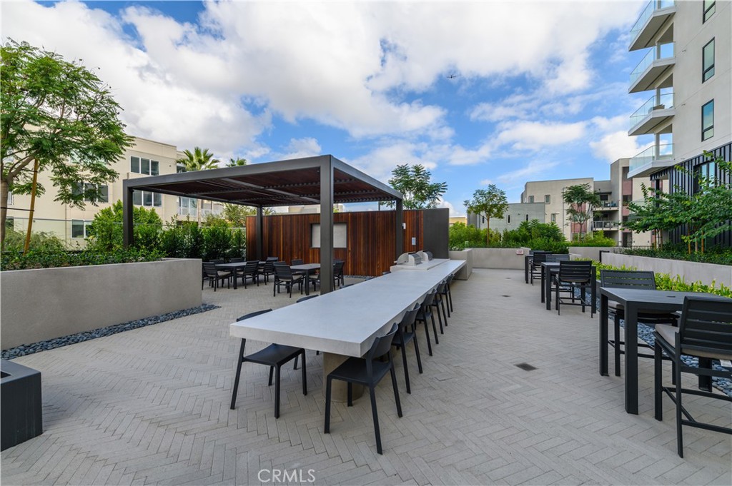 3608 Rivington Irvine, CA 92612 - Photo 46 of 53 a view of a patio with a table and chairs