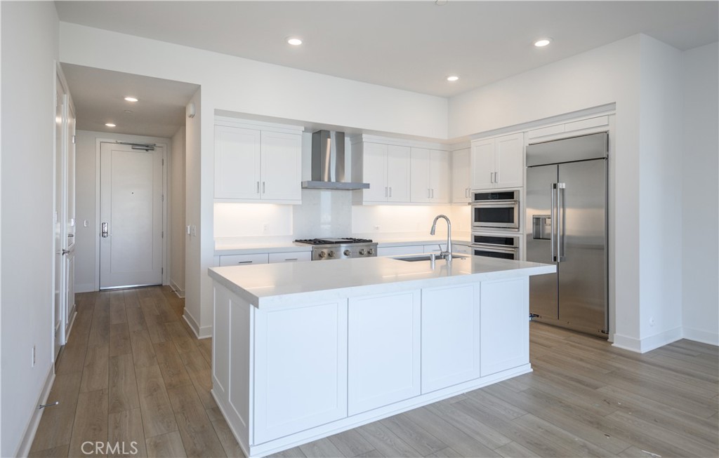 3608 Rivington Irvine, CA 92612 - Photo 9 of 53 a kitchen with stainless steel appliances granite countertop a refrigerator a sink and a stove