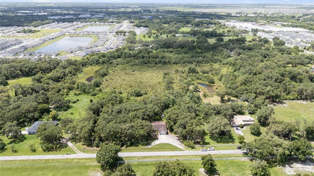 2810 Horton Road Kissimmee, FL 34744 - Photo 26 of 30 an aerial view of residential houses with outdoor space and trees