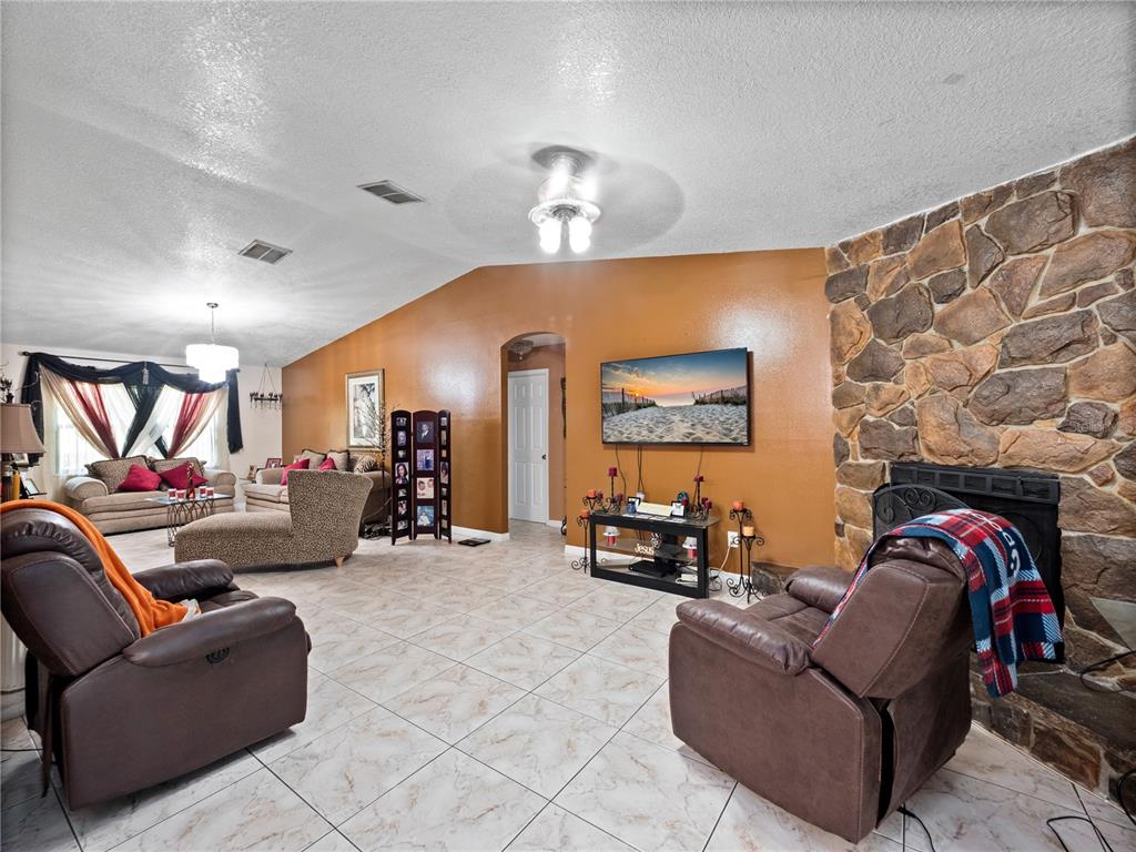 2810 Horton Road Kissimmee, FL 34744 - Photo 5 of 30 a living room with furniture and a flat screen tv