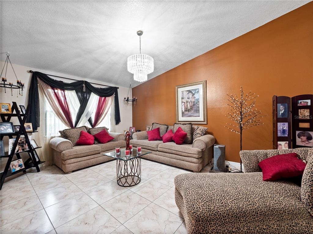 2810 Horton Road Kissimmee, FL 34744 - Photo 8 of 30 a living room with furniture and a flat screen tv