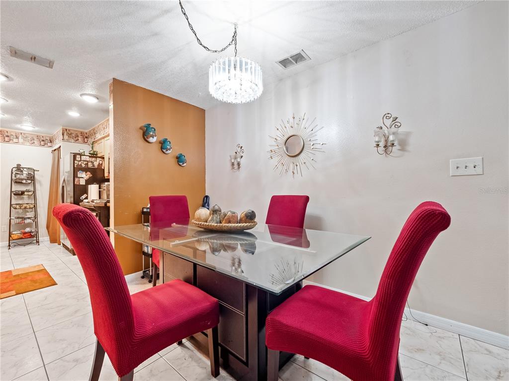 2810 Horton Road Kissimmee, FL 34744 - Photo 10 of 30 a view of a dining room with furniture