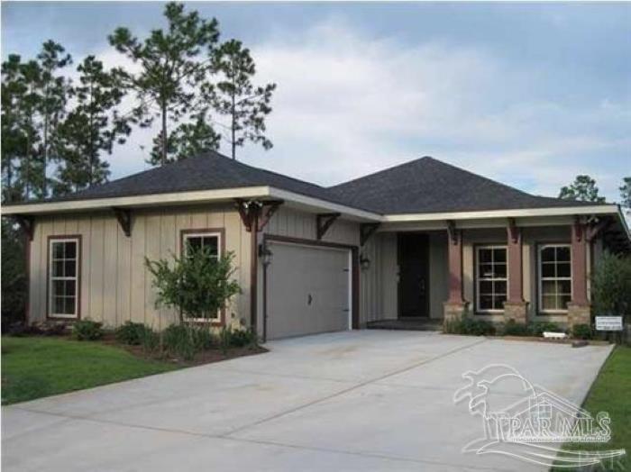 front view of a house with a garden