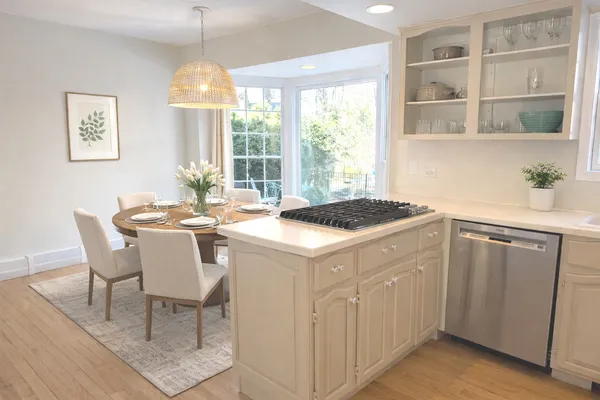 a kitchen that has a cabinets and a table in it