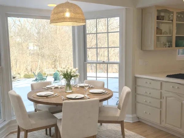 a dining room with furniture and window