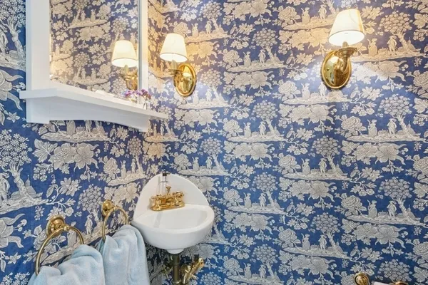 a bathroom with a sink and mirror