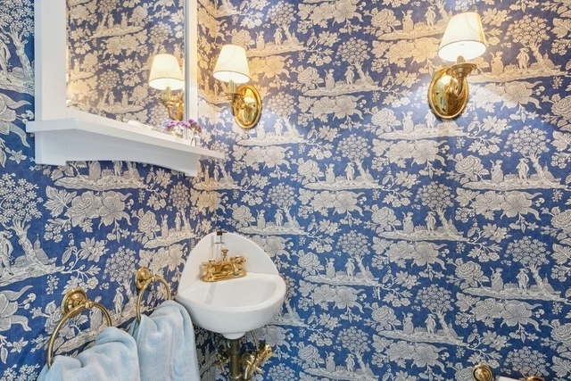 259 Ravine Drive Highland Park, IL 60035 - Photo 14 of 33 a bathroom with a sink and mirror