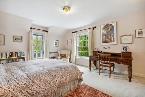 a bedroom with a bed and a desk