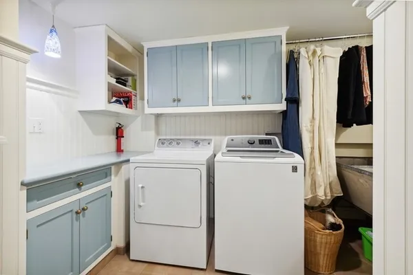 a view of storage and utility room with washer and dryer