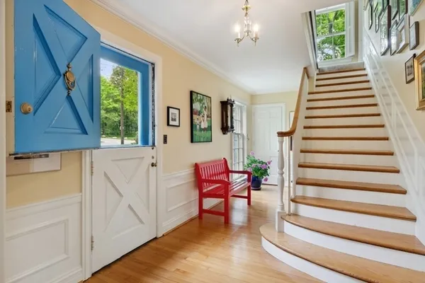 a view of entryway with furniture and window