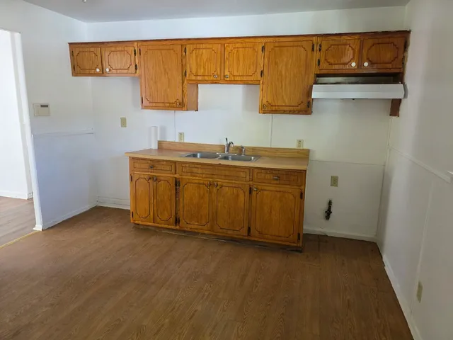 a kitchen with a sink and cabinets