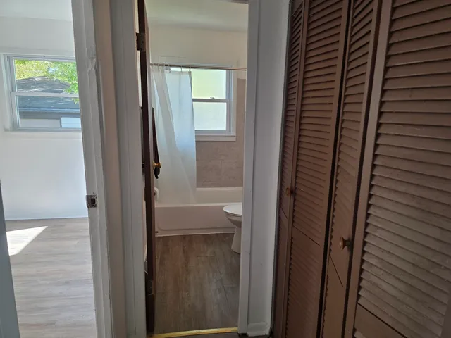 a bathroom with a toilet a sink and a bathtub