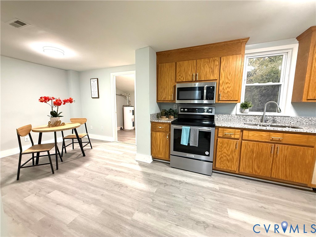 1748 Youngs Road Petersburg, VA 23803 - Photo 15 of 25 Kitchen featuring stainless steel appliances, brow