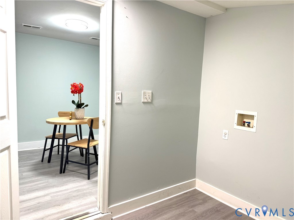 1748 Youngs Road Petersburg, VA 23803 - Photo 18 of 25 Laundry room featuring light wood-style floors and