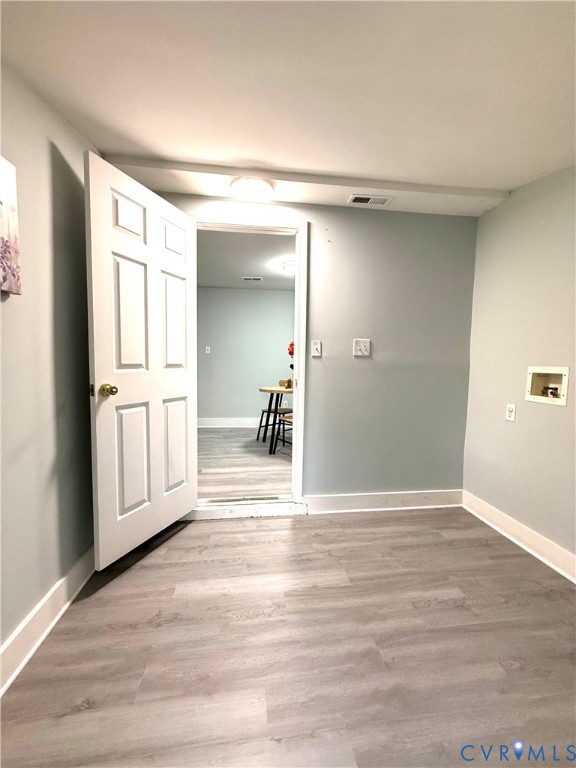 1748 Youngs Road Petersburg, VA 23803 - Photo 20 of 25 Spare room featuring baseboards and light wood-typ