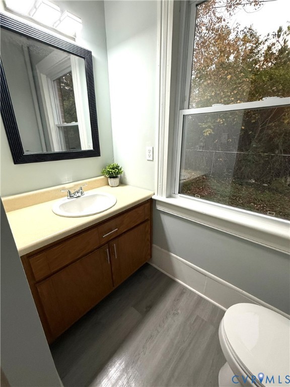 1748 Youngs Road Petersburg, VA 23803 - Photo 23 of 25 Half bath featuring dark wood finished floors and
