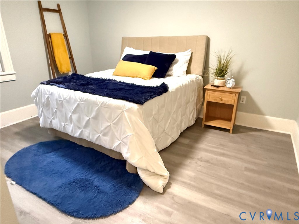 1748 Youngs Road Petersburg, VA 23803 - Photo 8 of 25 Bedroom featuring wood finished floors