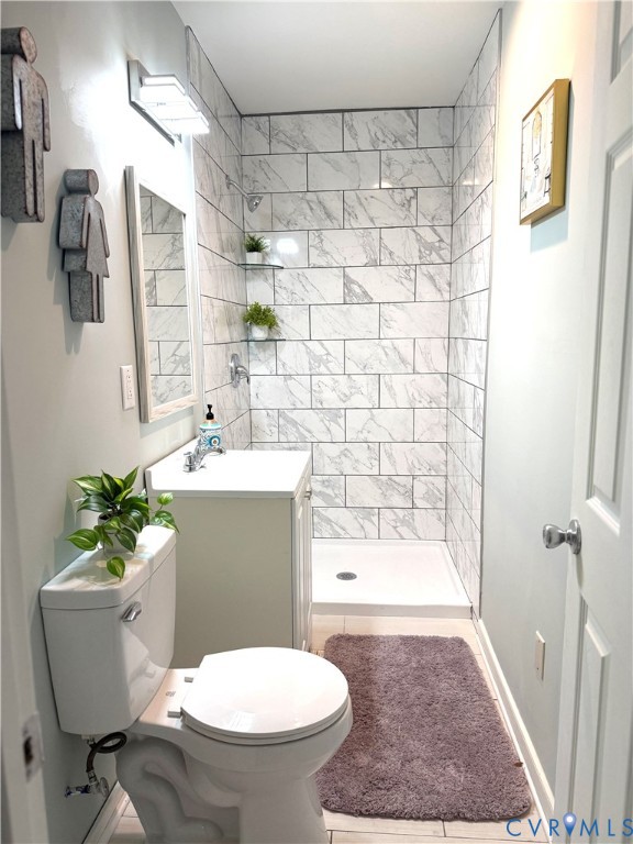 1748 Youngs Road Petersburg, VA 23803 - Photo 10 of 25 Bathroom with a stall shower, vanity, and light ti