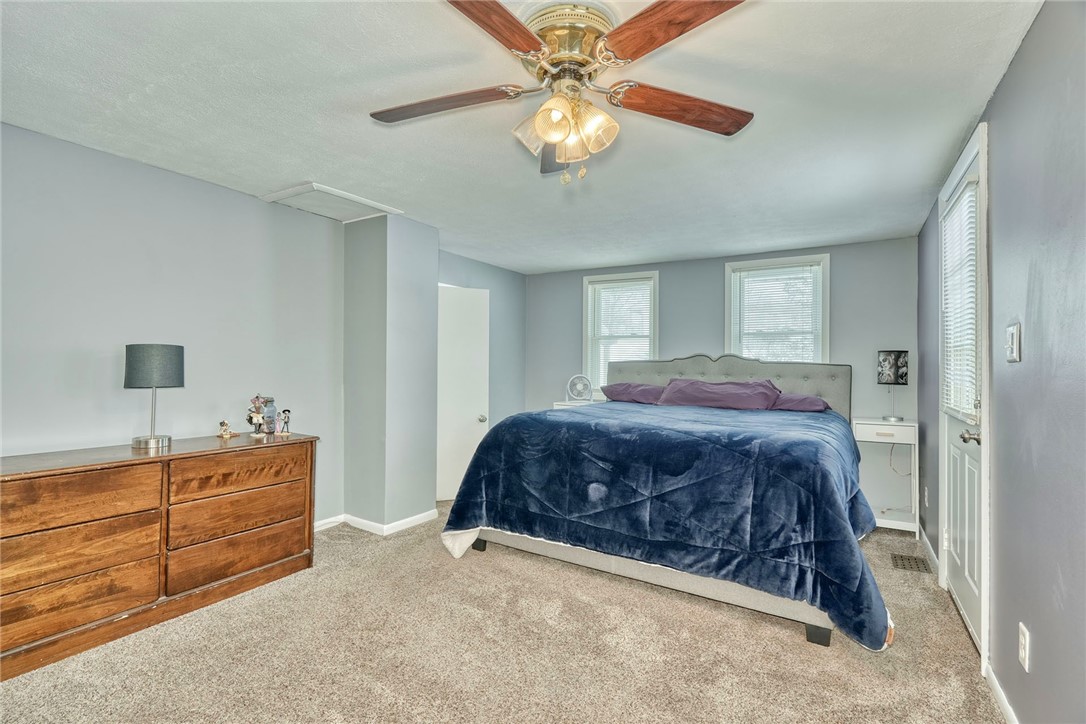 778 Macedon Center Road Perinton, NY 14450 - Photo 16 of 34 Primary bdrm with access to the second floor deck.