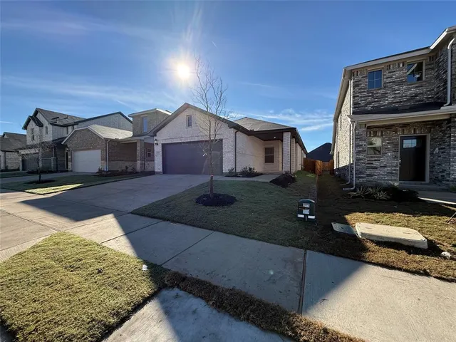 front view of a house with yard