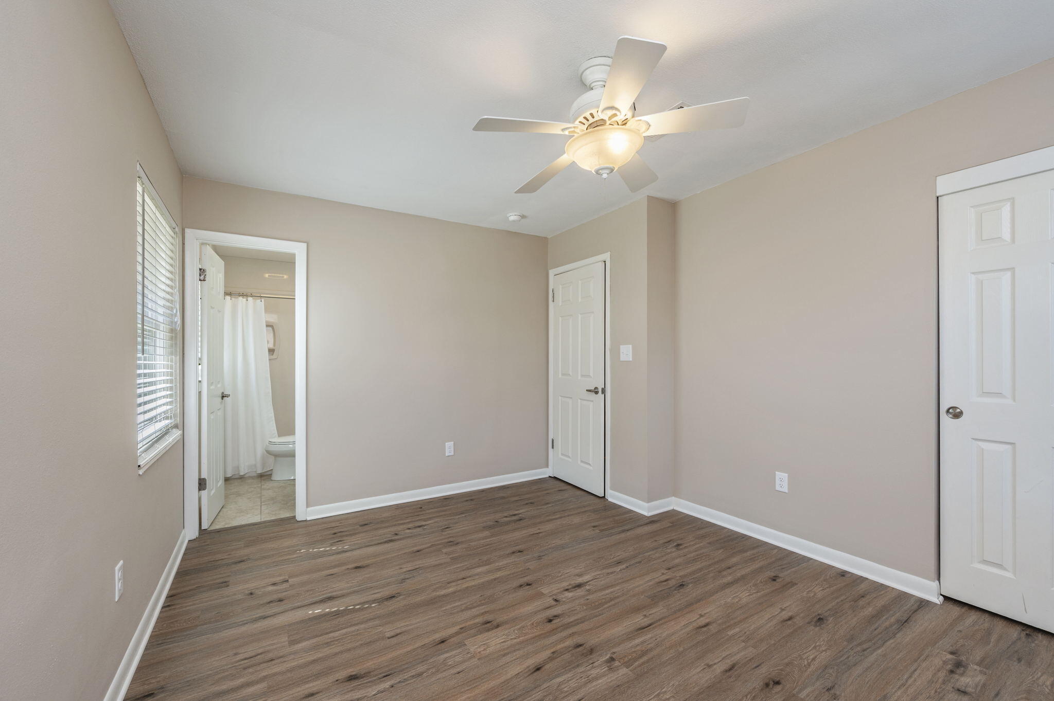 512 23rd Street Niceville, FL 32578 - Photo 16 of 19 a view of an empty room with wooden floor