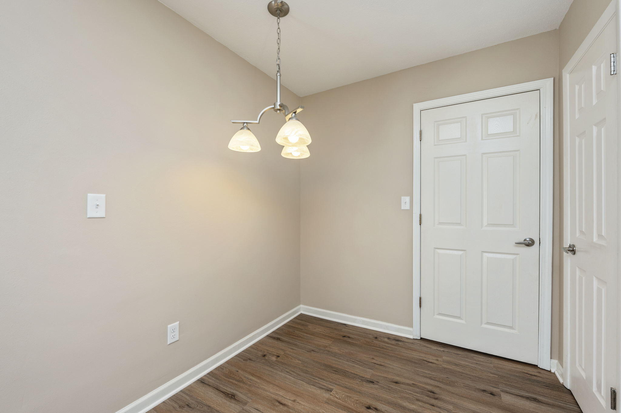 512 23rd Street Niceville, FL 32578 - Photo 8 of 19 an empty room with wooden floor and windows