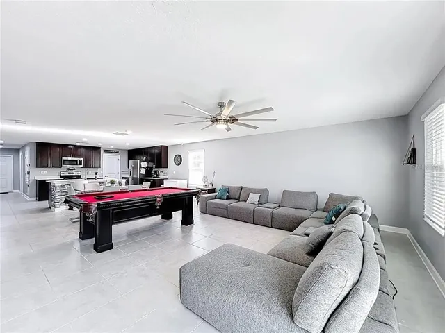 a living room with furniture and a rug